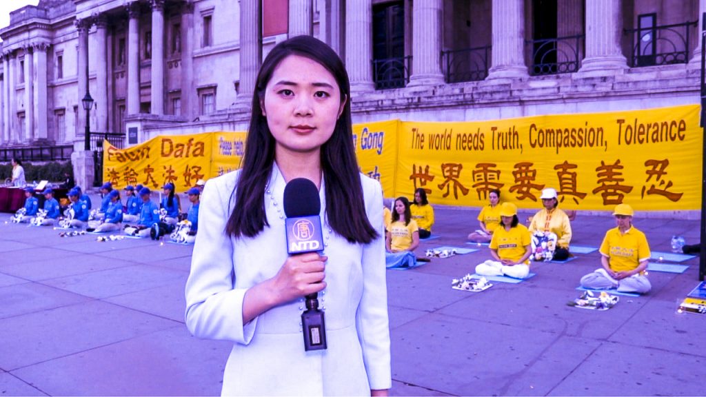 In front of National Gallery at Trafalgar Square, Sophia Sun reported on a rally of Falun Dafa practitioners calling for end the persecution in mainland China. Photo credit: Vanning