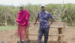 Two farmers standing in a field